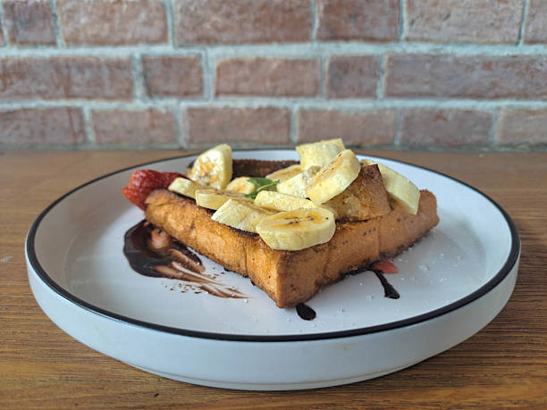 istock Yummy Banana Caramel Toast With Chocolate Sauce, Strawberry Jam, Grilled Toast Bread And Strawberry Fruit. Dessert Food Menu. 2209183473