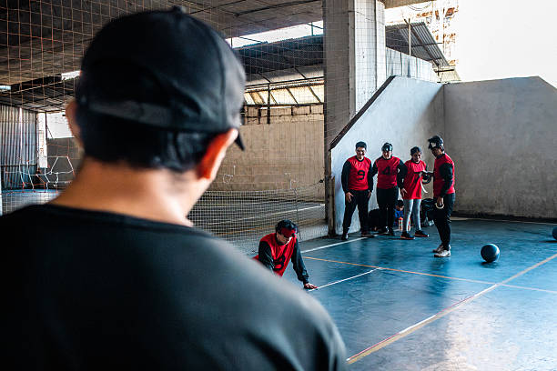 Visually impaired people during handball training at sport court
