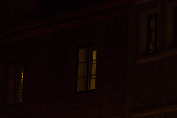 istock Illuminated Windows in Dark European Old Town. Intricate architecture details. 2209186639