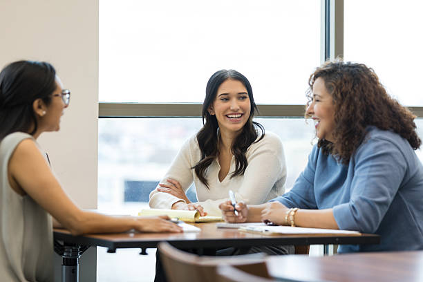 istock Three Diverse Women in Casual Clothing Having a Discussion 2209187567
