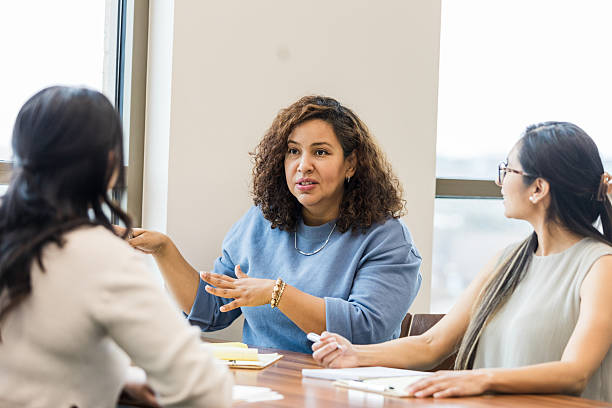 istock Three Diverse Women in a Business Meeting, Discussing Ideas 2209187591