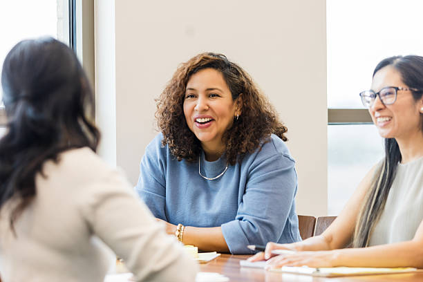 istock Diverse Women in a Meeting, Showing Teamwork and Happiness 2209187607