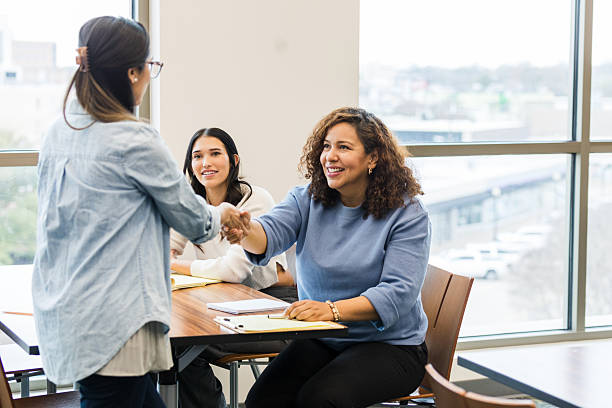 istock Three Cheerful Women in a Meeting, Discussing Ideas 2209187614