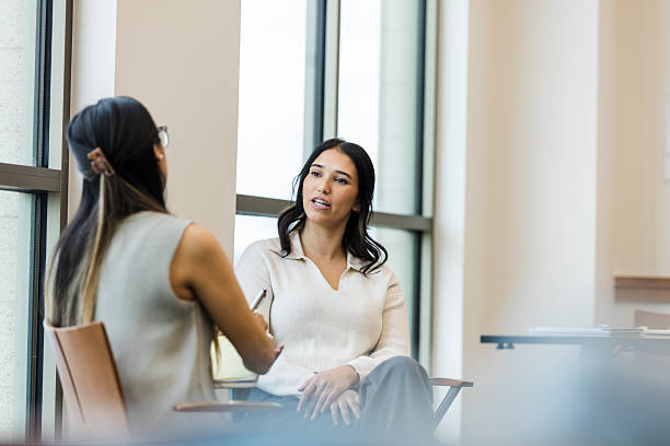 istock Two Women in Casual Clothing Having a Discussion 2209187619