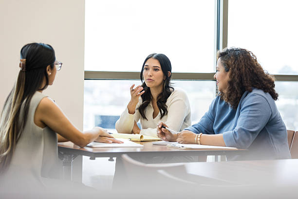 istock Three Diverse Women in Discussion, Teamwork and Collaboration 2209187624