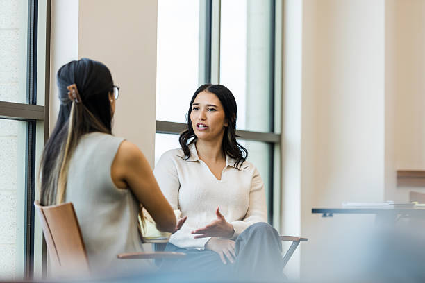 istock Two Women Having a Heartfelt Conversation in a Bright Office 2209187642