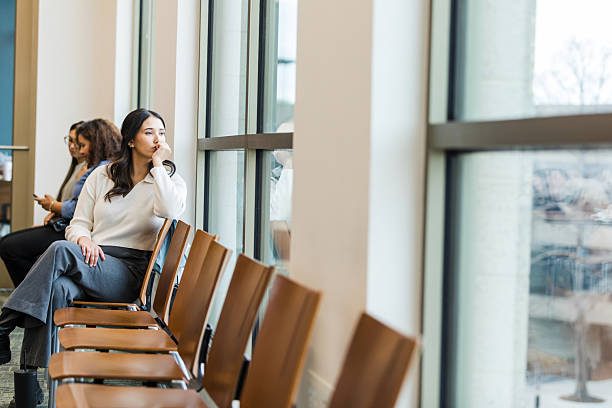 Young Latina Woman Waiting Pensively by Window