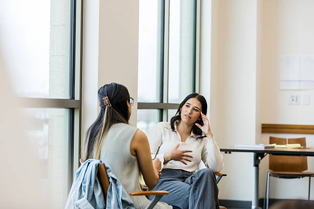 istock Counseling Session: Two Diverse Women Talking and Listening 2209187771