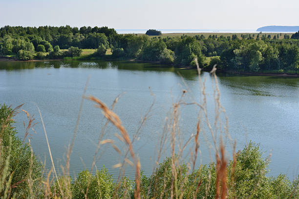istock A serene lake landscape with trees, sky and water reflection in the summer 2209190214