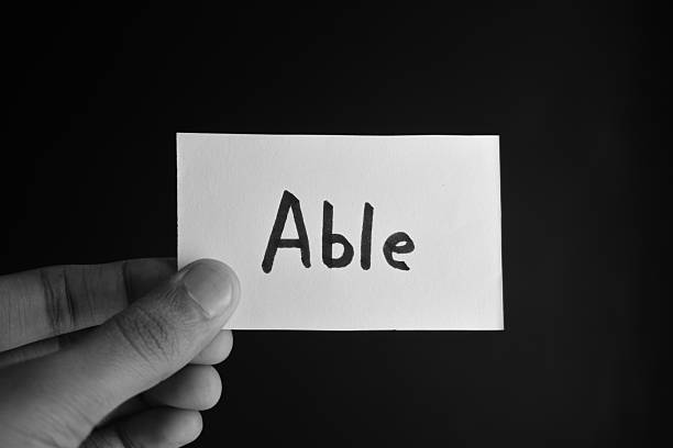istock Hand holding a paper card with the word ABLE 2209190855