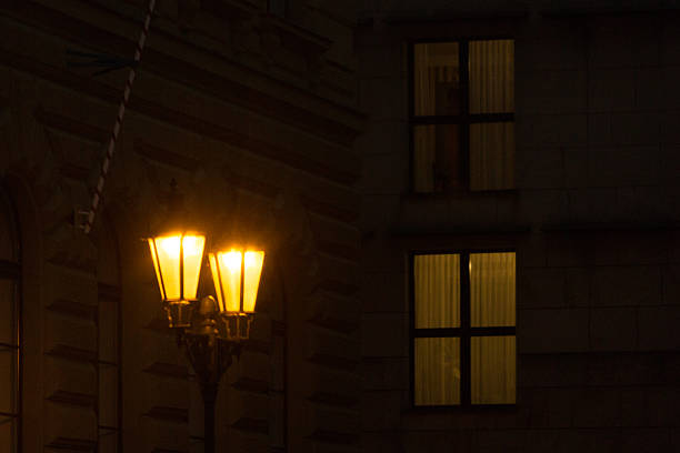 istock Illuminated Windows in Dark European Old Town. Intricate architecture details. 2209191279