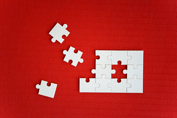 Brain shaped jigsaw puzzle on blue background