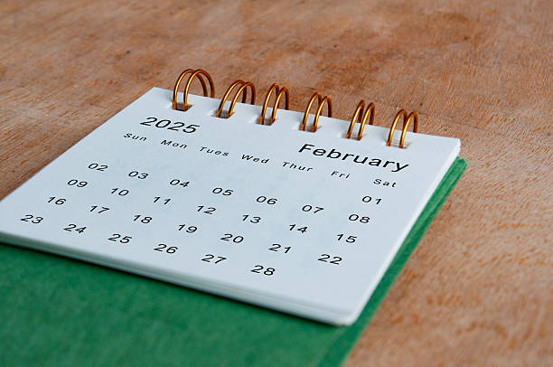 istock February 2025 calendar on wooden table. Calendar concept 2209191918