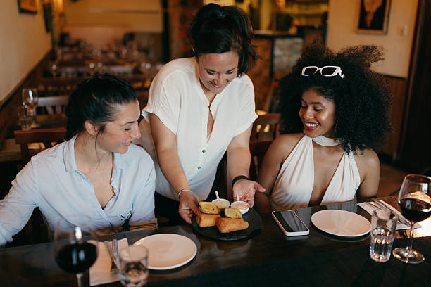istock Female Chef Serving Appetizer to Guests in Sri Lankan Restaurant 2209193257