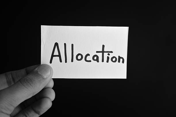 istock Hand holding a paper card with the word ALLOCATION 2209195734