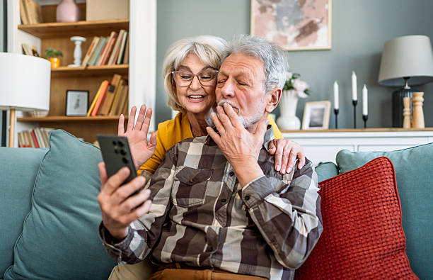 istock Senior couple having a video call at home 2209195798