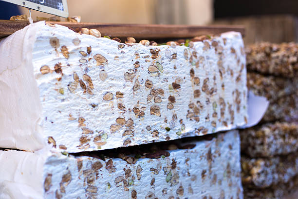 Pieces of delicious nougat as background, closeup