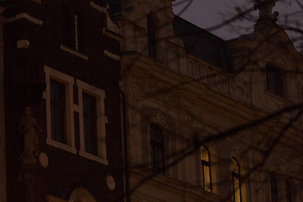 istock Illuminated Windows in Dark European Old Town. Intricate architecture details. 2209196096