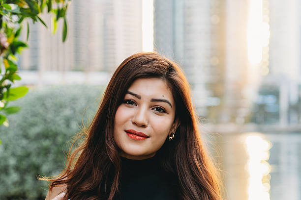 istock Young woman smiling in Dubai Marina district 2209196959