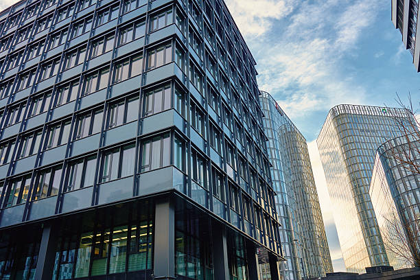 istock Modern office buildings with glass and concrete facades 2209197876