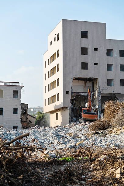 istock Construction machinery is demolishing the house 2209201640