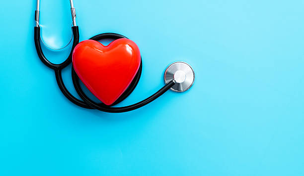 istock Red heart and stethoscope on blue background 2209202051
