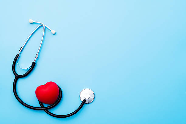 istock Red heart and stethoscope on blue background 2209202066