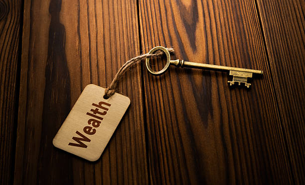 istock Vintage key and paper label with the text wealth 2209202191