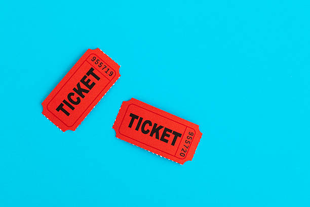 Pair of red old tickets on blue background