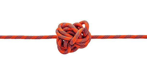 istock An orange climbing rope with a complex knot in the middle 2209202461