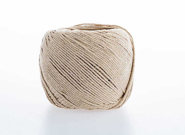 Ball of cotton string on white background