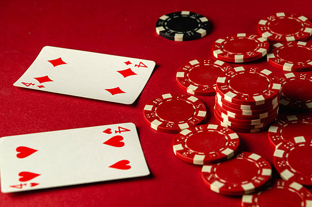 istock A group of playing cards, one pair, and poker chips are arranged on a red table, creating an atmosphere of excitement during a friendly gaming evening. A modest but pleasant win in poker 2209205326