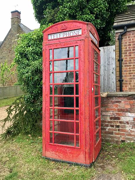 istock Ubiquitous Red English Phone Box, Northamptonshire, England 2209206603