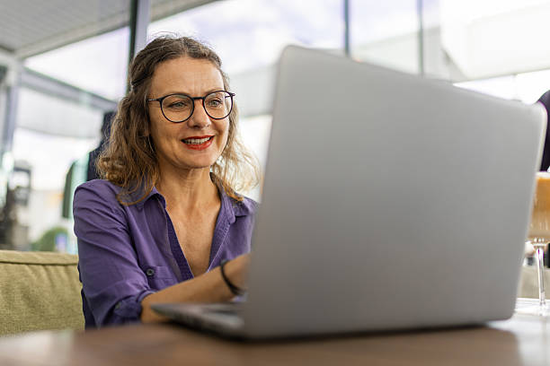 istock Confident businesswoman working remotely from cafe 2209208284
