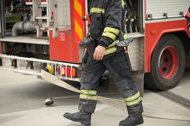 Redondo Beach, CA - July 5, 2005: A California firefighter on the scene of a wildfire that occurred in Redondo Beach, CA on July 5th, 2005. The firefighter is wearing fire fighter issued gear as he fights a wildfire.