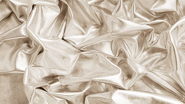 istock Light soft pastel pale brown beige nude white abstract shiny fabric background. Shine sparkle glitter liquid fluid metal metallic foil. Fold ripple drapery. Design. Luxury style beauty glamour festive. 2209214642