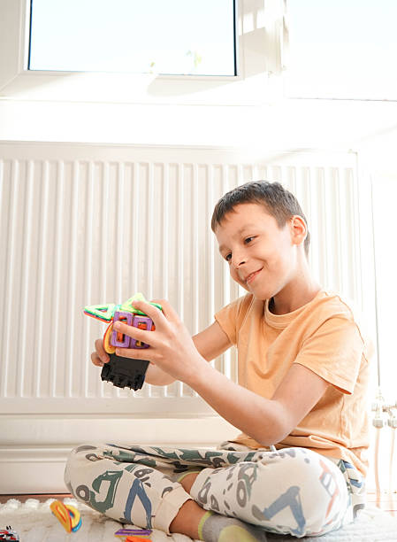istock A child is playing with his toys. 2209214950