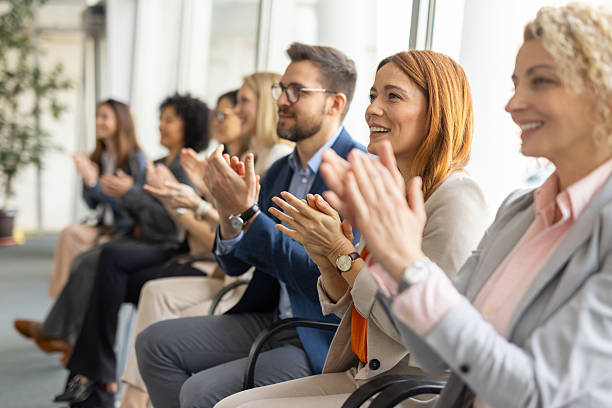 istock Team Applauding and Celebrating in Contemporary Office Space 2209219826