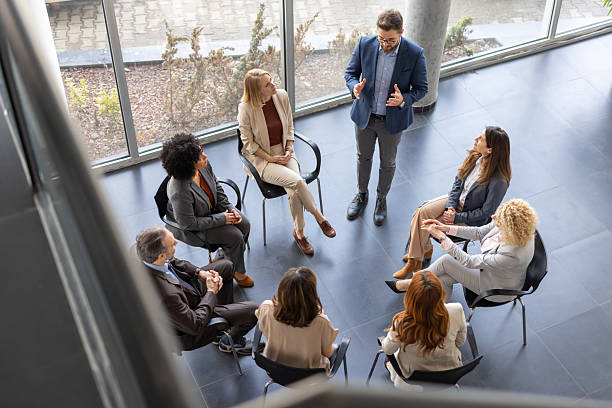 istock Group discussion among professionals in a meeting 2209219851