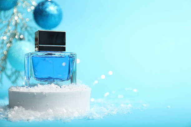 Blue perfumery blank bottle isolated on black background