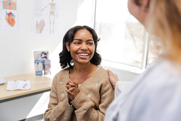 istock Supportive Doctor and Happy Patient in Clinic 2209226370