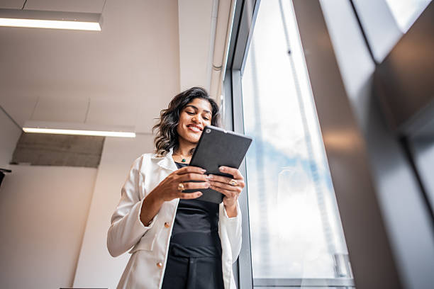 istock Young businesswoman using a digital tablet at the office 2209226837