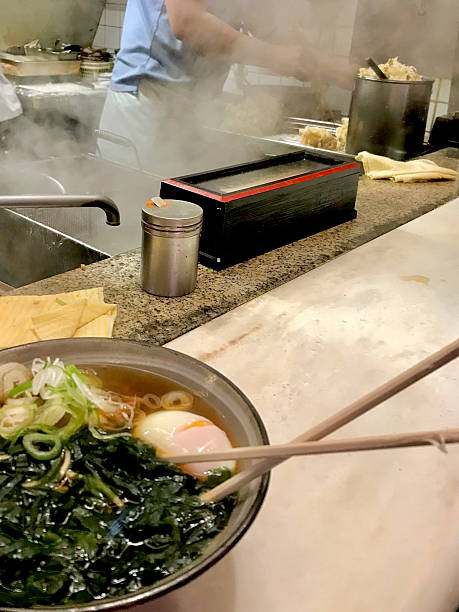 Bowl of hot ramen at eating bar, Tokyo