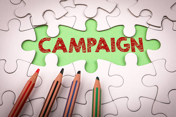istock Campaign Concept. White puzzle pieces and colored pencils 2209229736