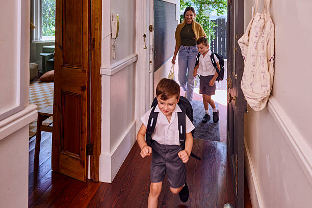 istock Mother leaving home with children going to school 2209231442