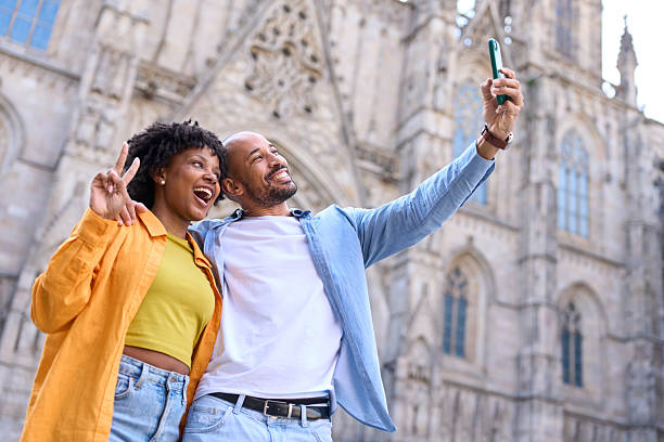 istock Tourists taking a selfie in front of barcelona cathedral 2209233231