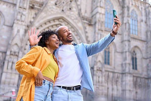 istock Tourists taking selfie in front of barcelona cathedral 2209233236