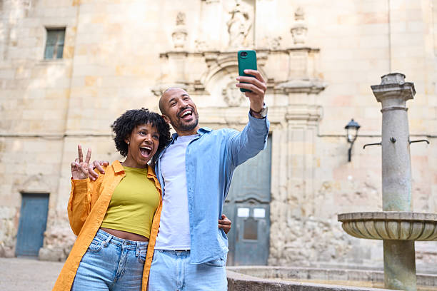 istock Tourists taking a selfie in barcelona, spain 2209233298