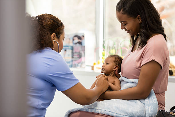 istock Pediatrician examining a baby with mother present 2209234363