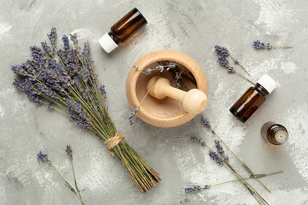 istock Lavender sprigs with mortar and pestle on concrete background,, top view 2209235334